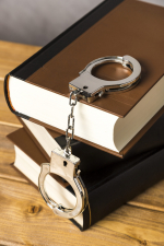 close-up-with-handcuffs-books