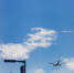 the plane is flying in the blue sky - NeruLife.Ru